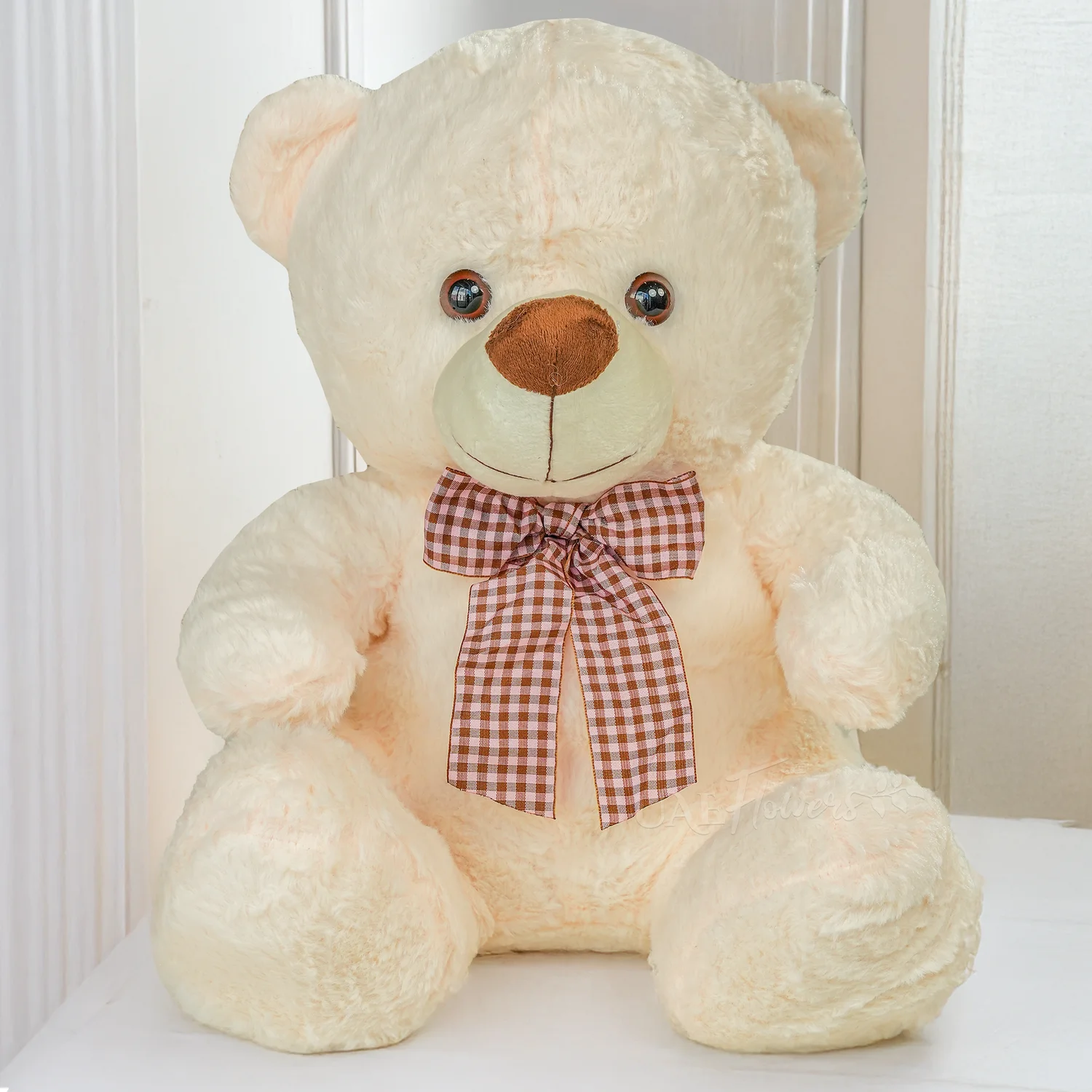 Bouquet of 3 red roses with green fillers in nice wrapping, a small white teddy bear and 1 kg chocolate cake.