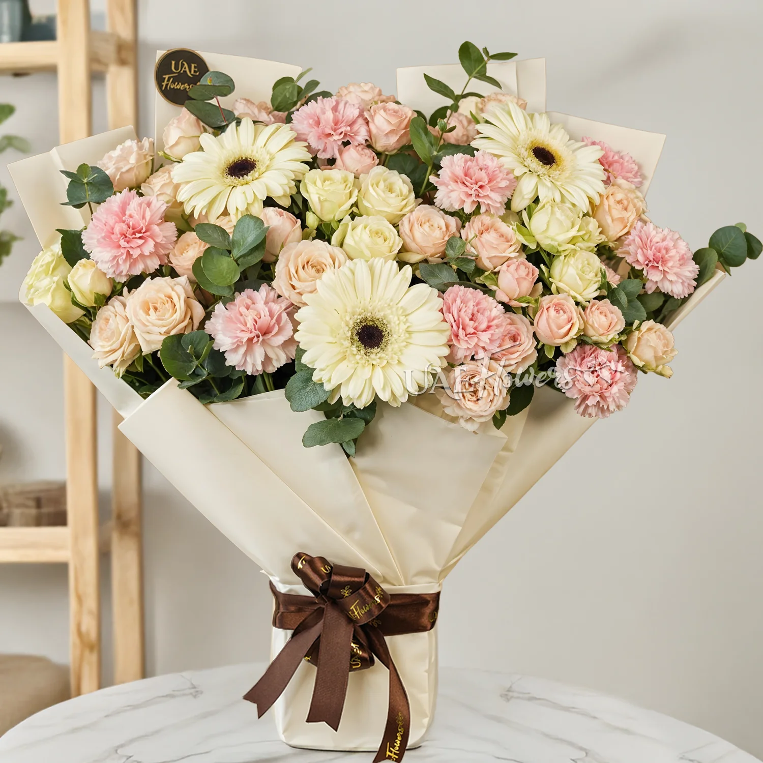 3 white gerberas, 10 pink carnations, 5 pink spray roses, and 5 white spray roses with limonium