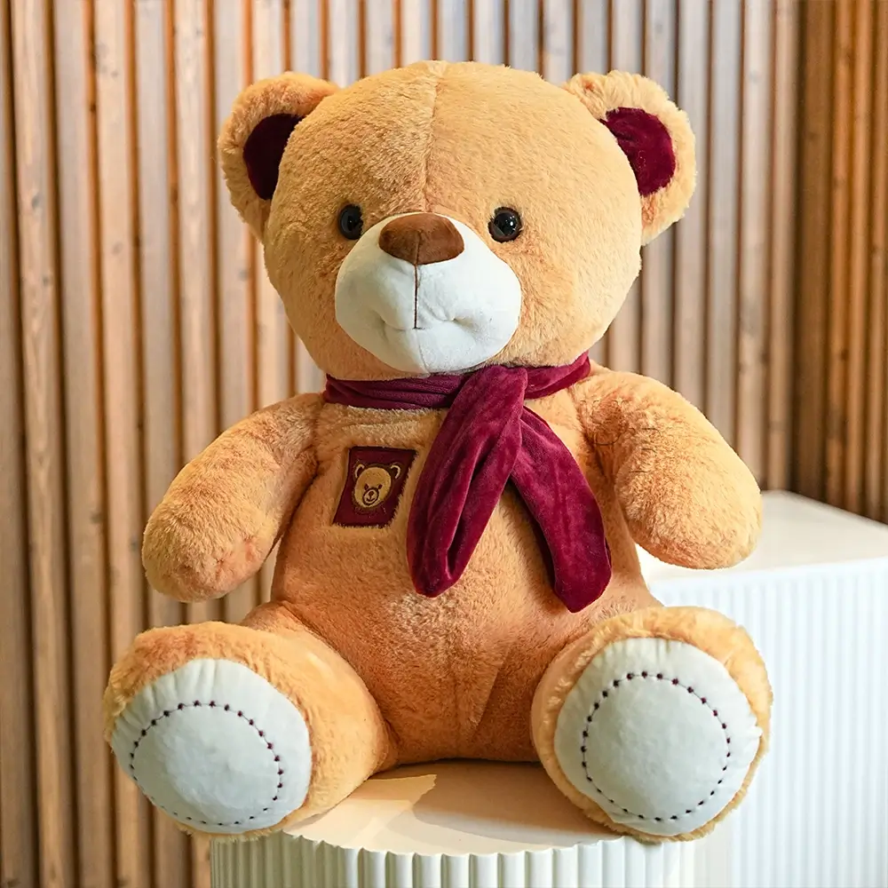 Bouquet of 8 pink carnations, 5 peach spray roses with green fillers in paper packing with ribbons, 1 kg black forest cake and a small brown teddy bear.
