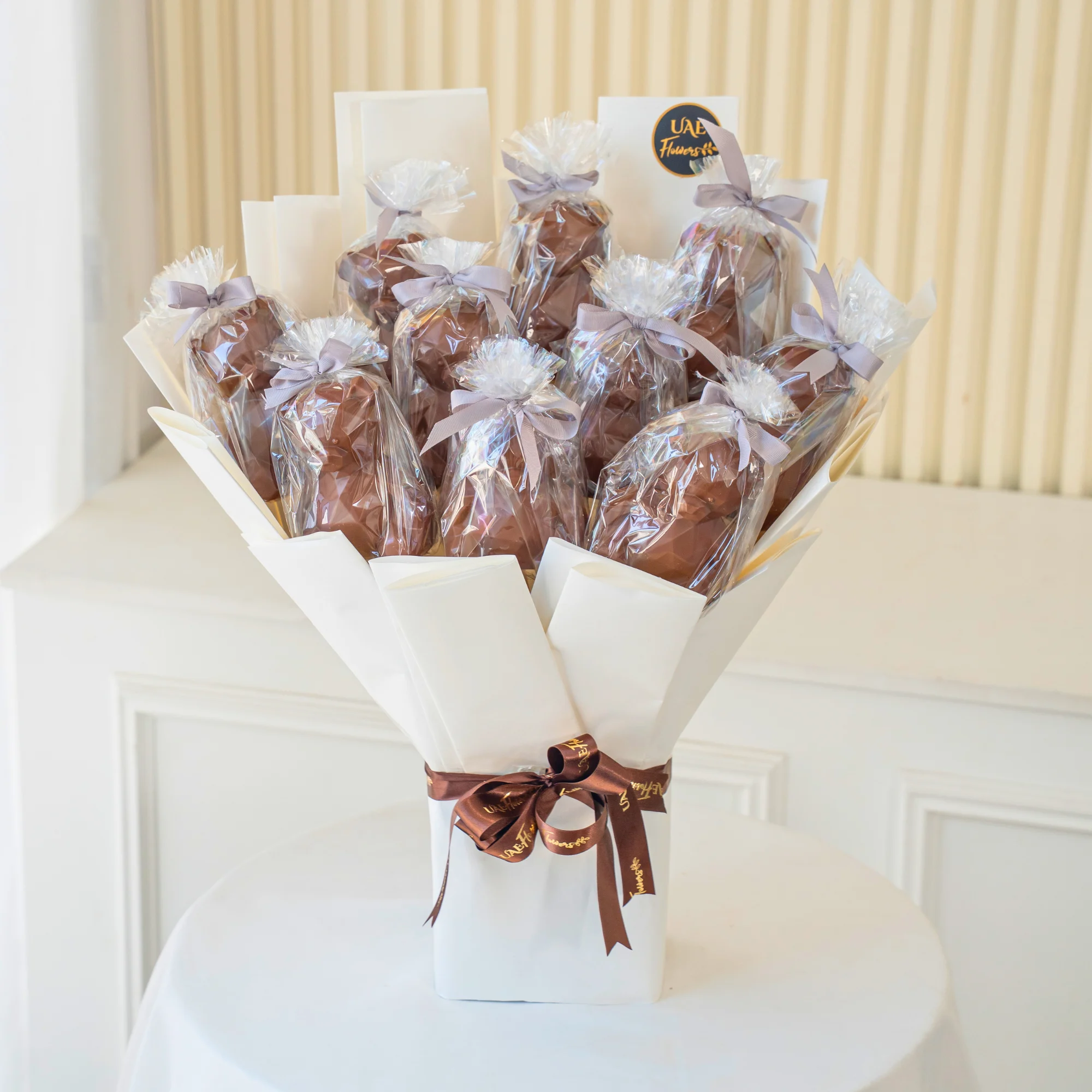 Luxury Choco Teddy Bliss Bouquet with 12 Teddy Shaped Chocolates in Premium White Wrapping and Brown Ribbon