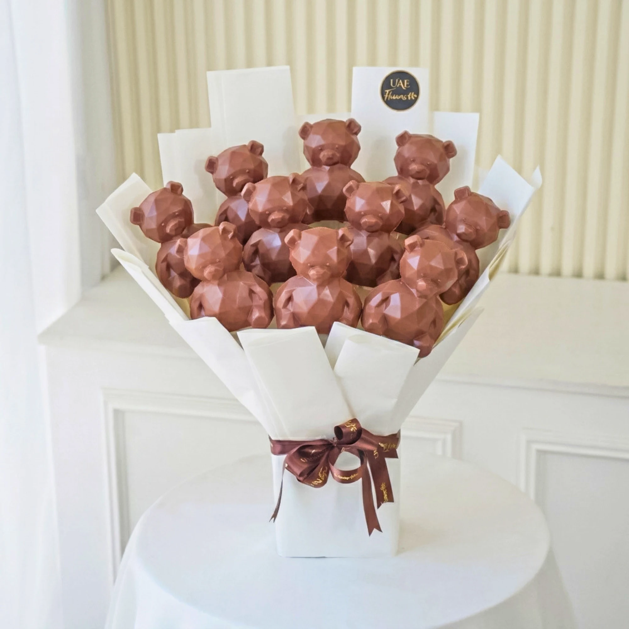 Luxury Choco Teddy Bliss Bouquet with 12 Teddy Shaped Chocolates in Premium White Wrapping and Brown Ribbon