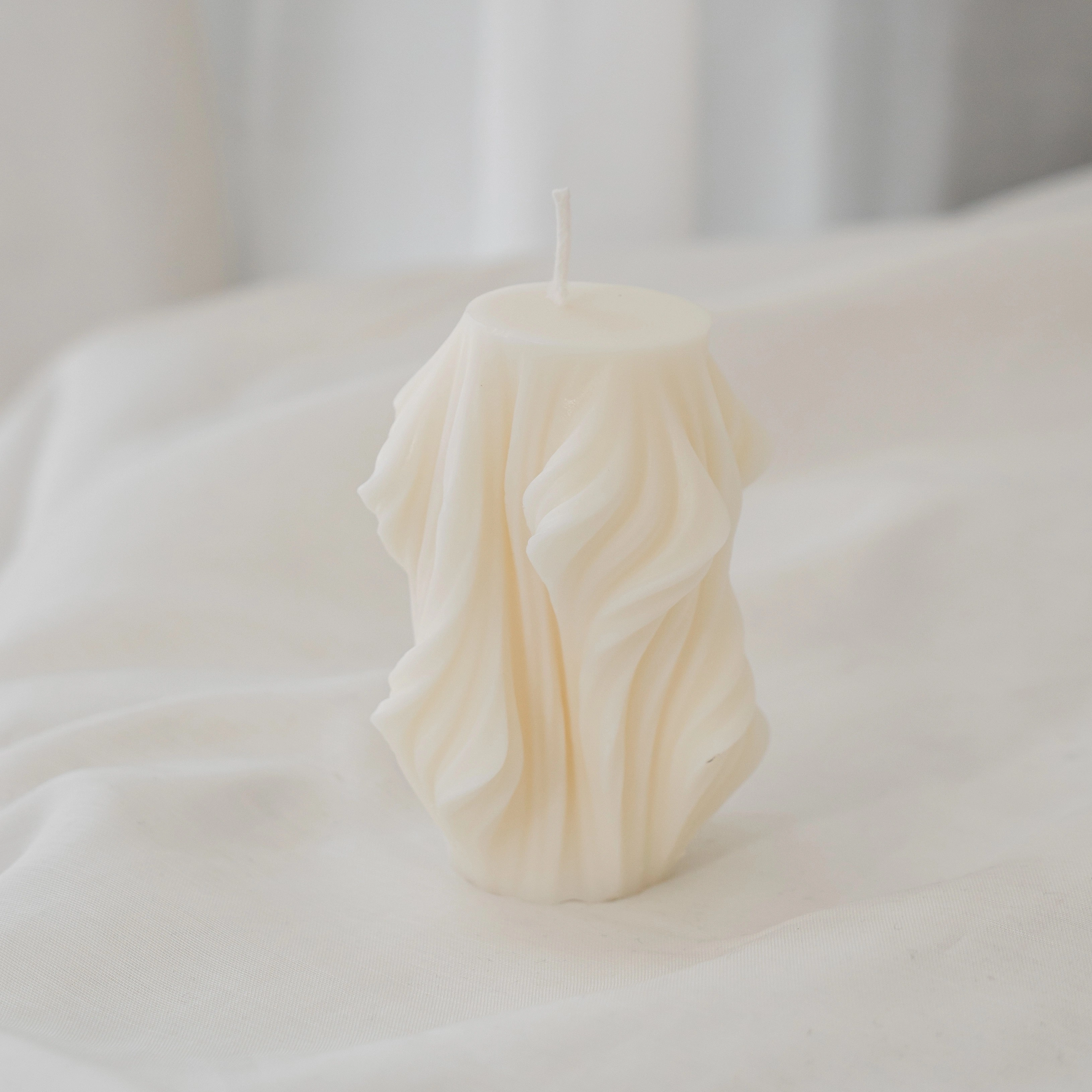 Handcrafted Ethereal Sculpted Candle in Ivory Wax with Flowing Contemporary Design for Modern Home Décor