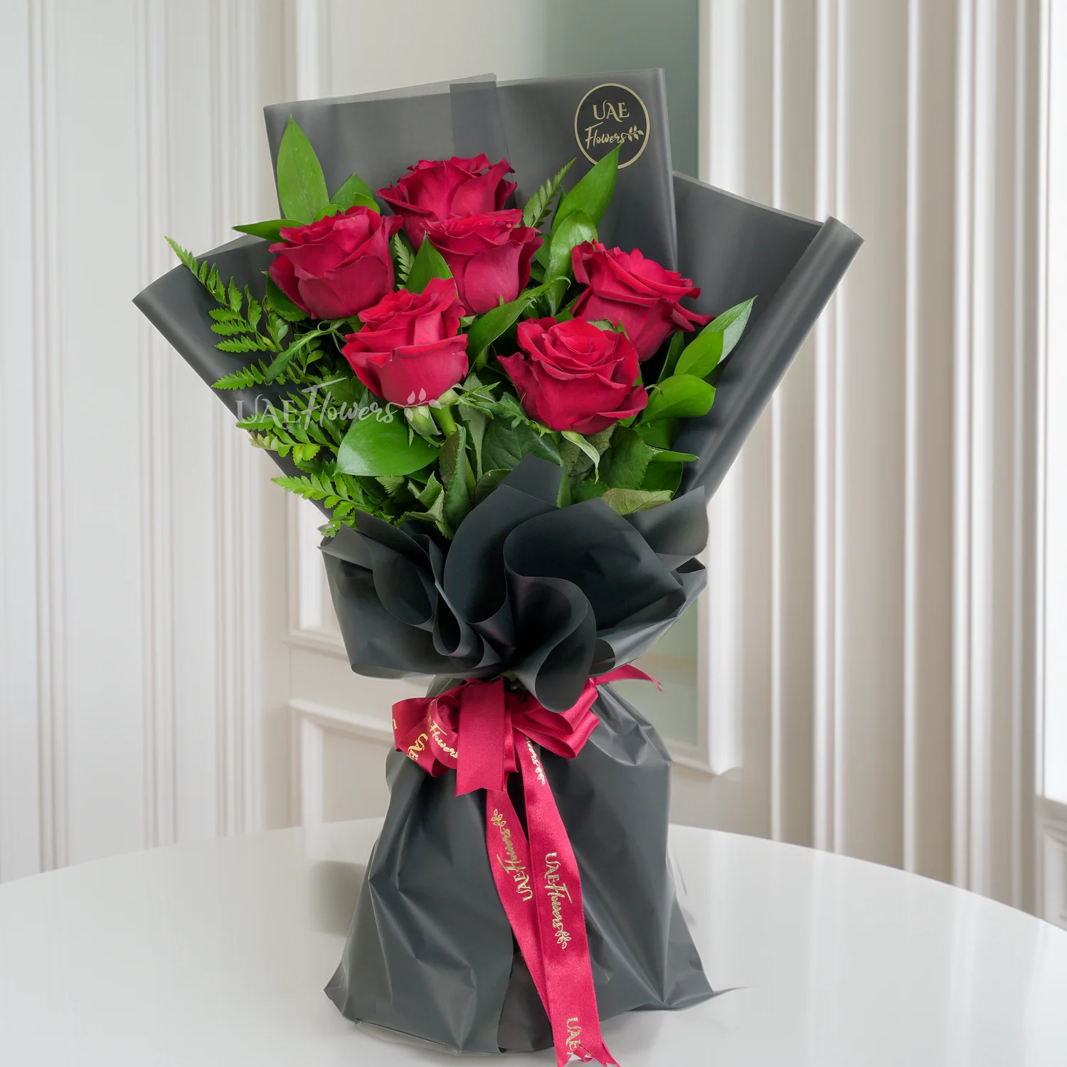 Bouquet of 6 red roses with 1 kg chocolate cake and HAPPY ANNIVERSARY foil balloon.