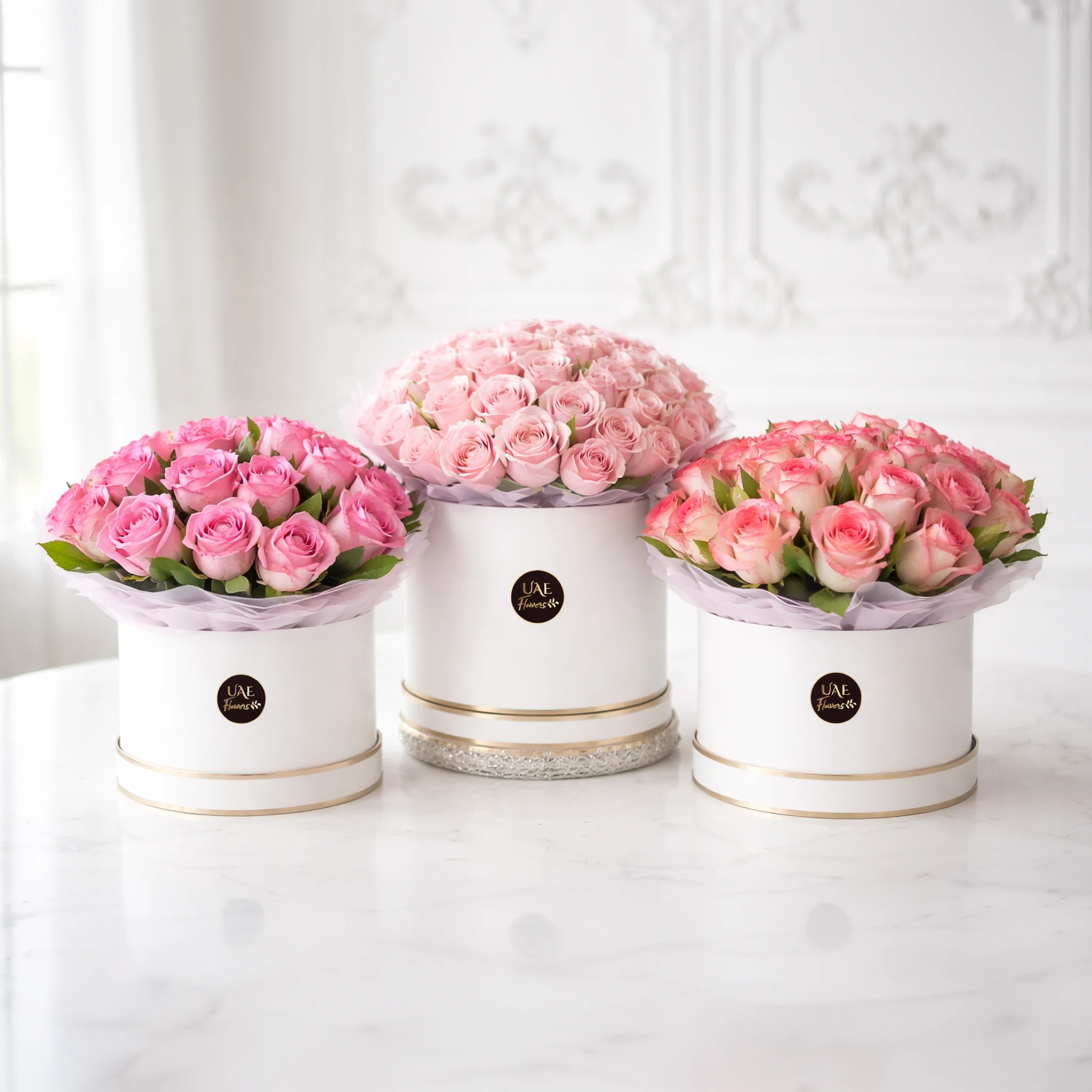 3 boxes with 50 light pink, 25 whitish pink, and 15 dark pink roses