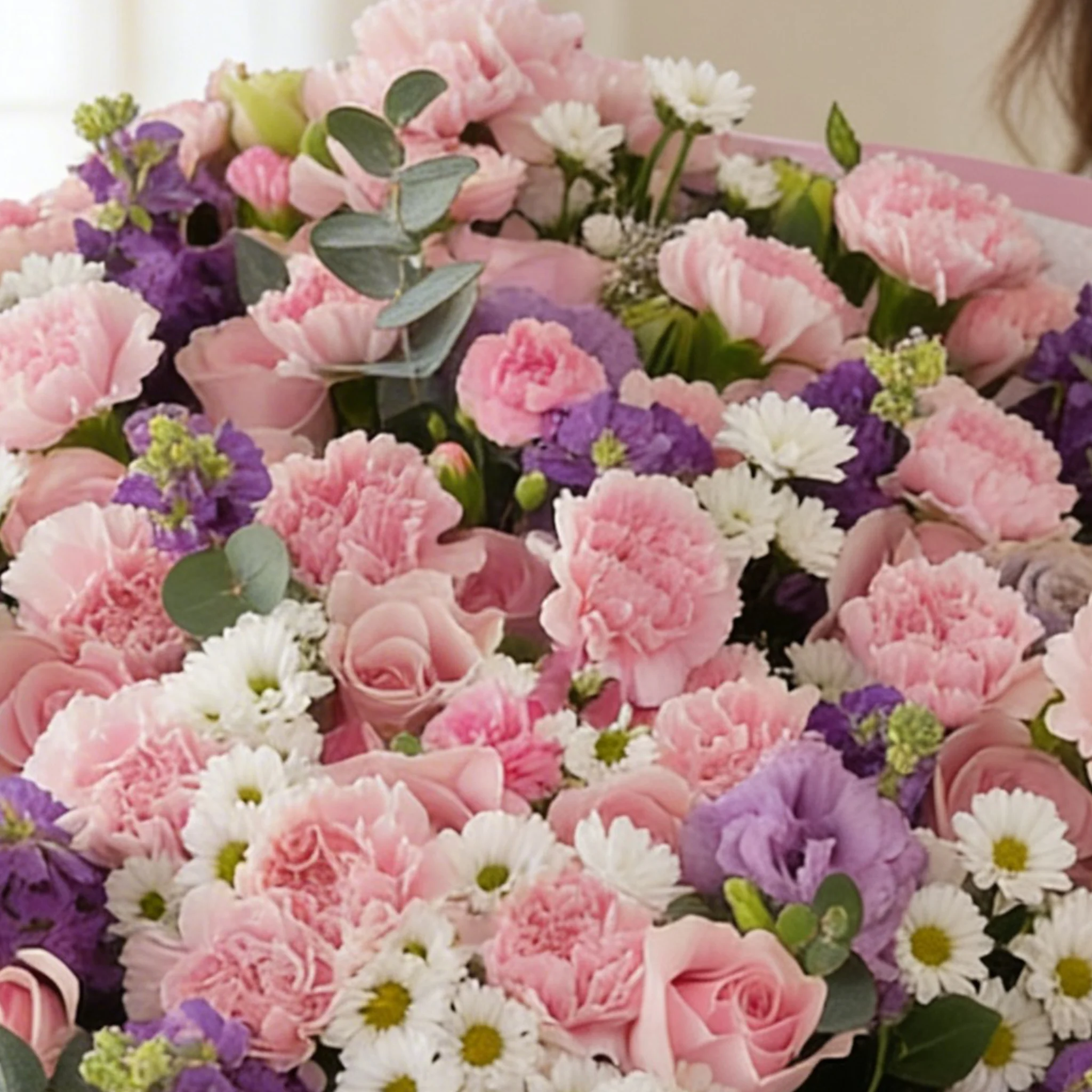 Bouquet of 10 purple matthiola, 10 white chrysanthemums, 10 purple lisianthus, 30 pink carnations and 50 pink roses with green fillers in nice wrapping.