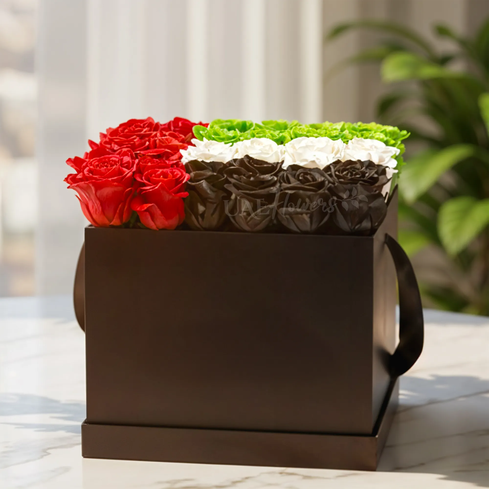 12 red roses, 8 green roses, 8 white roses, and 8 black sprayed roses in a black box