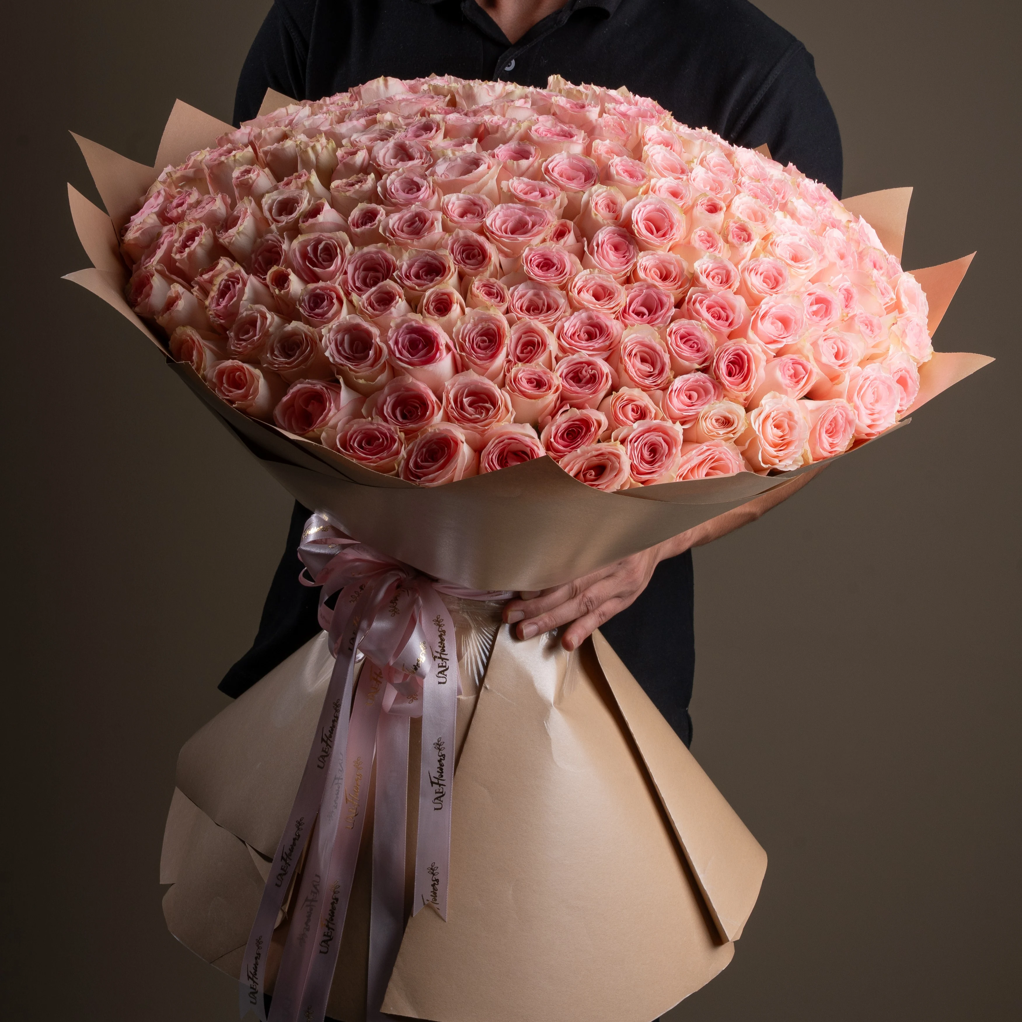 bouquet of 200 pink roses arranged with soft fillers