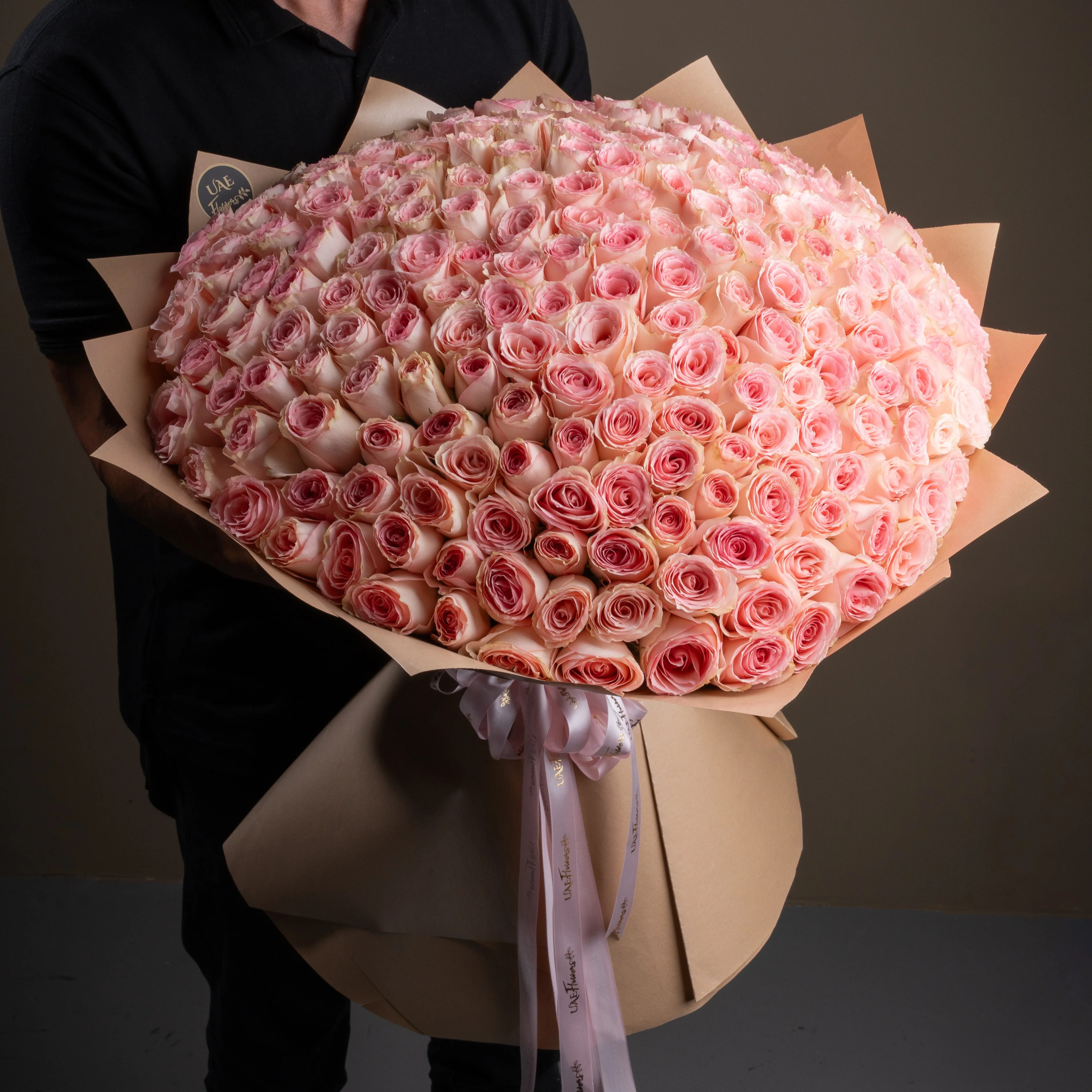 bouquet of 200 pink roses arranged with soft fillers