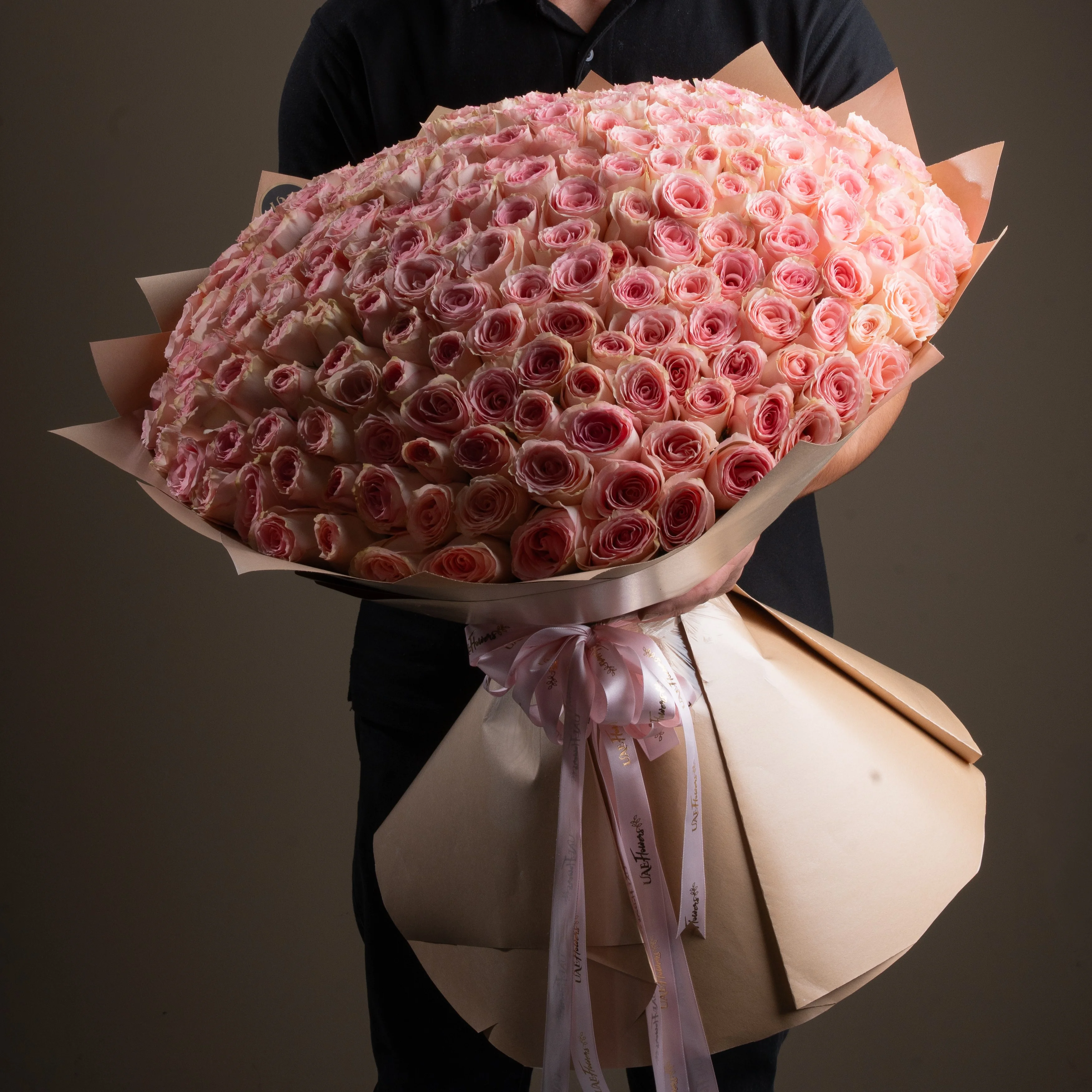 bouquet of 200 pink roses arranged with soft fillers