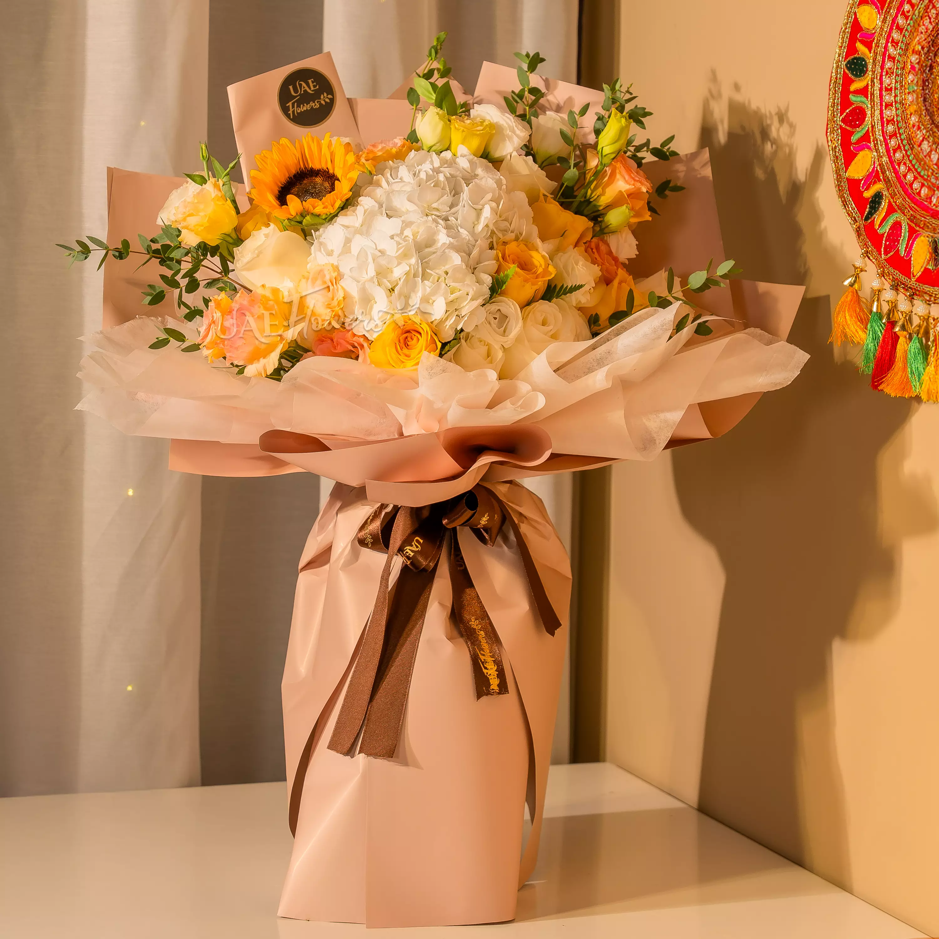 Sunflowers, white hydrangeas, and roses bouquet for Diwali by UAE Flowers Dubai