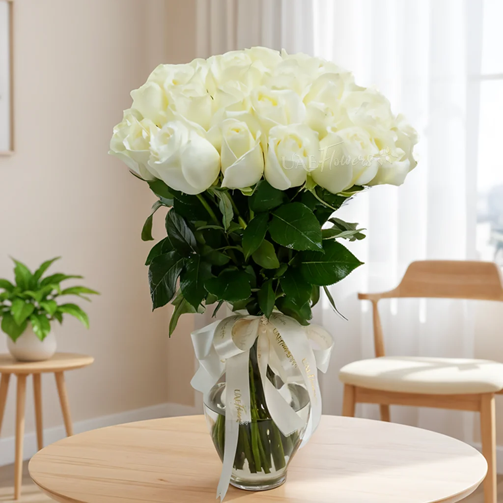 vase arrangement of 30 white roses