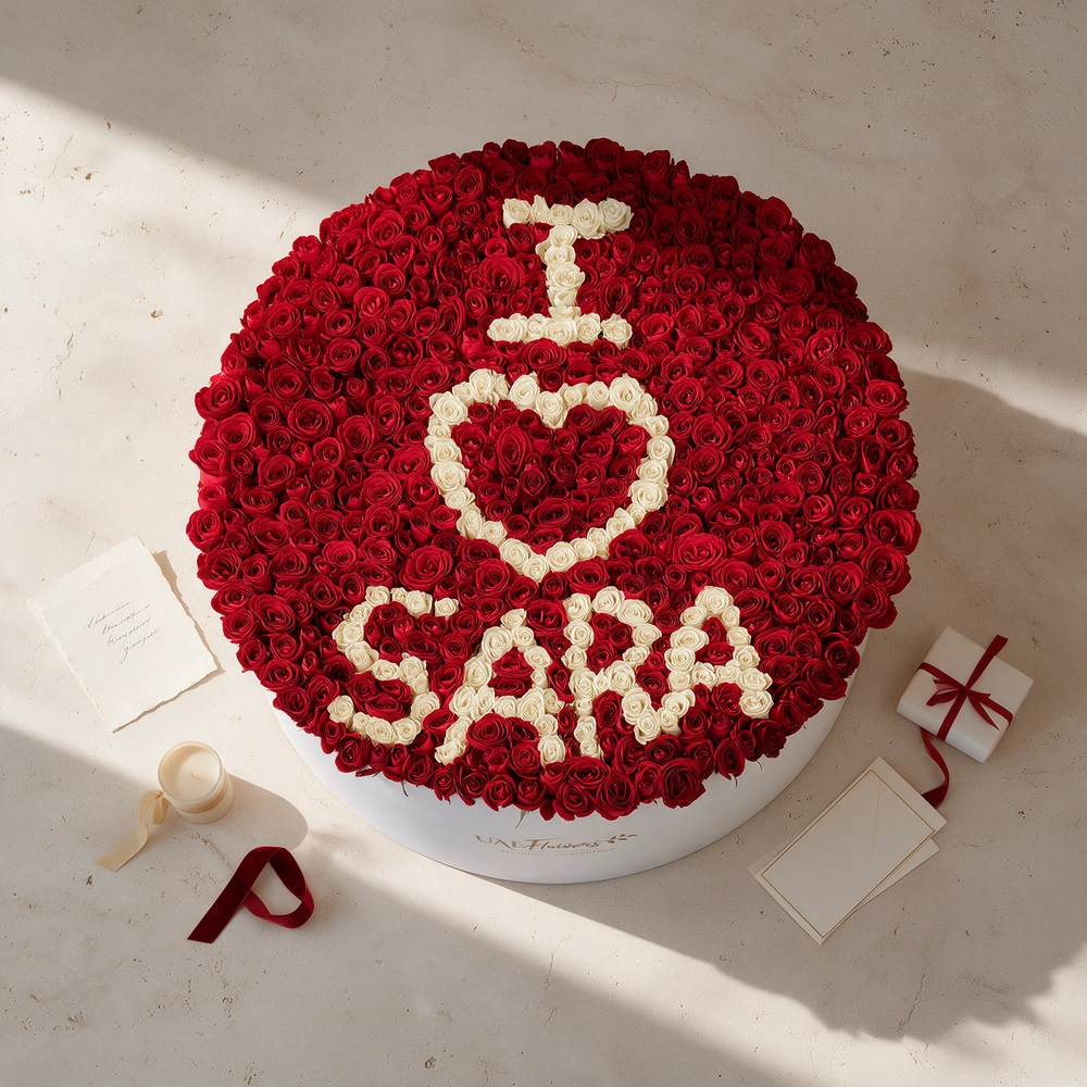 large flower box featuring 500 red rose buds and spray roses