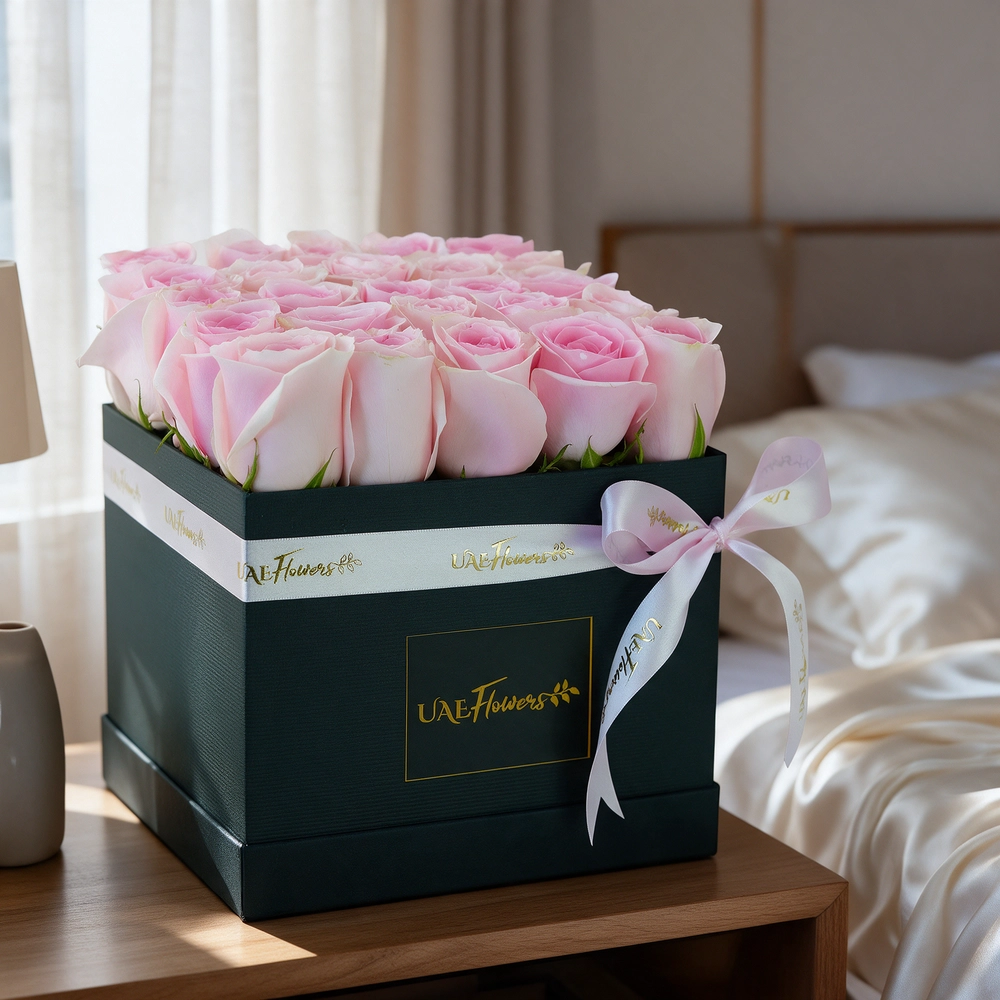 25 pink roses arranged in a square box