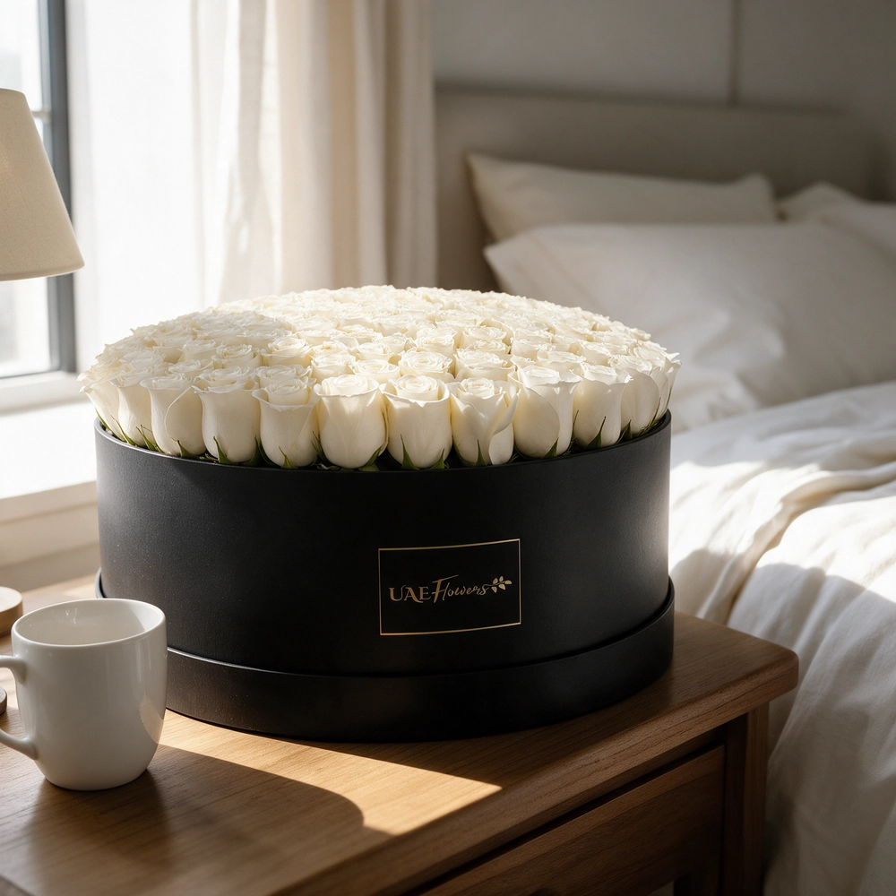 120 white roses neatly arranged in a box