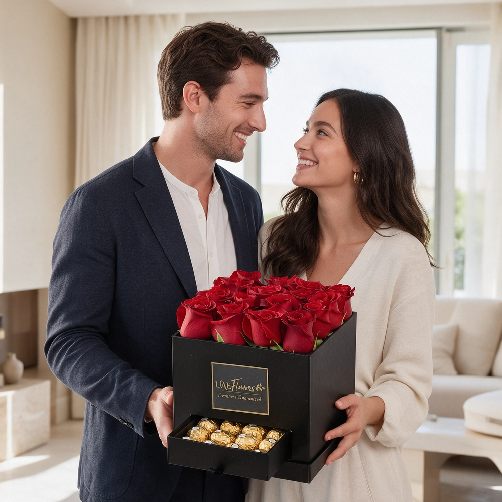 Black gift box with 16 red roses and 16 Ferrero Rocher chocolates, perfect for romantic occasions, anniversaries, or expressing love.
