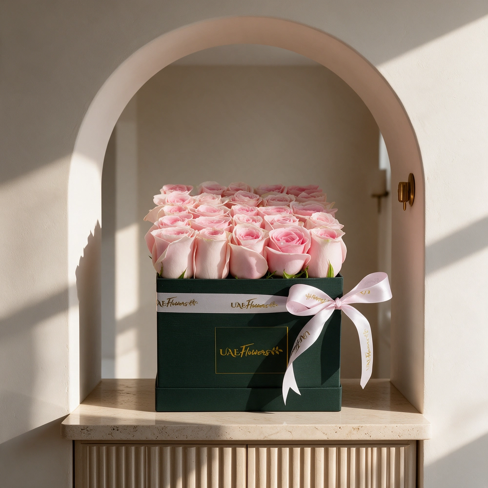 25 pink roses arranged in a square box