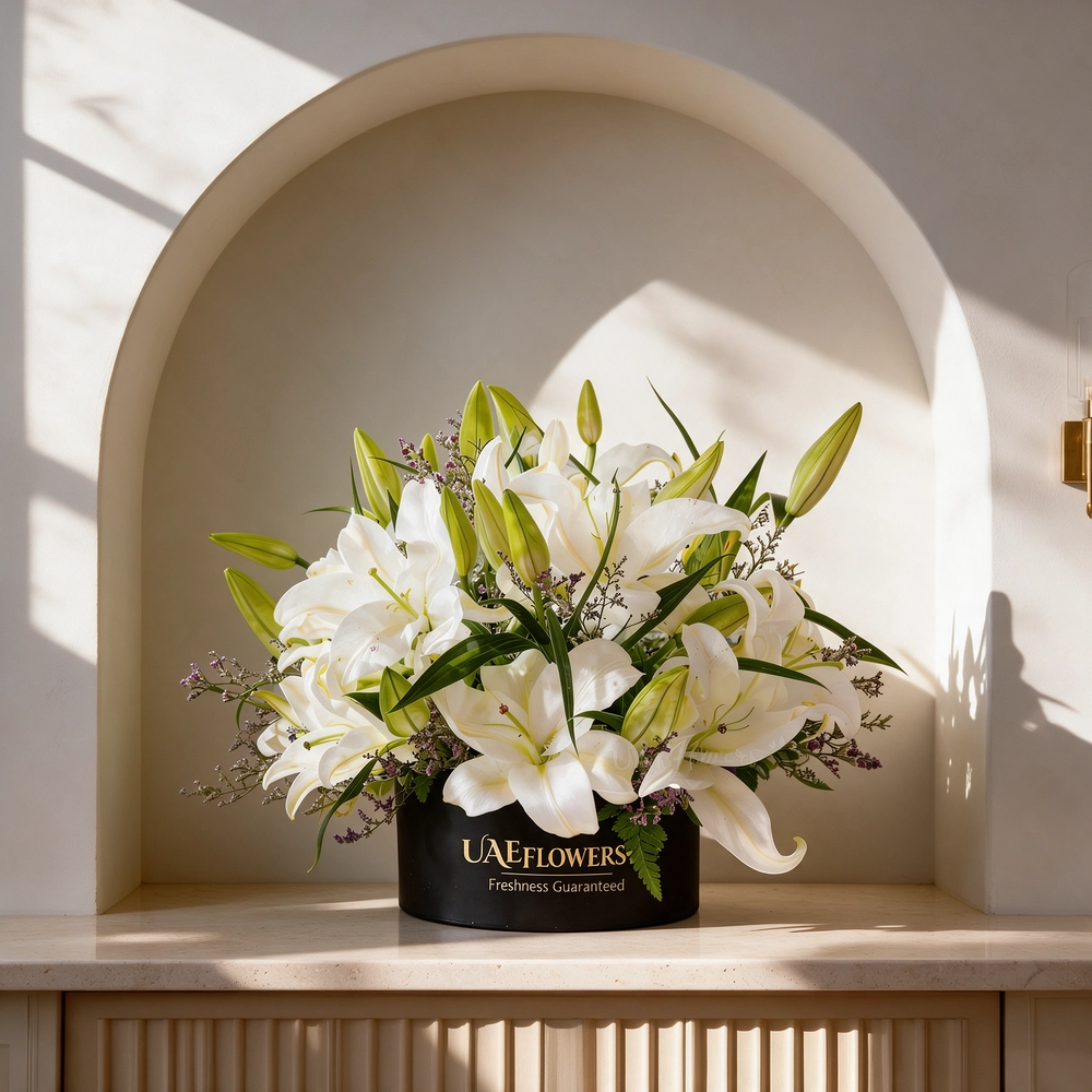 6 white lilies with limonium and green fillers in a black box
