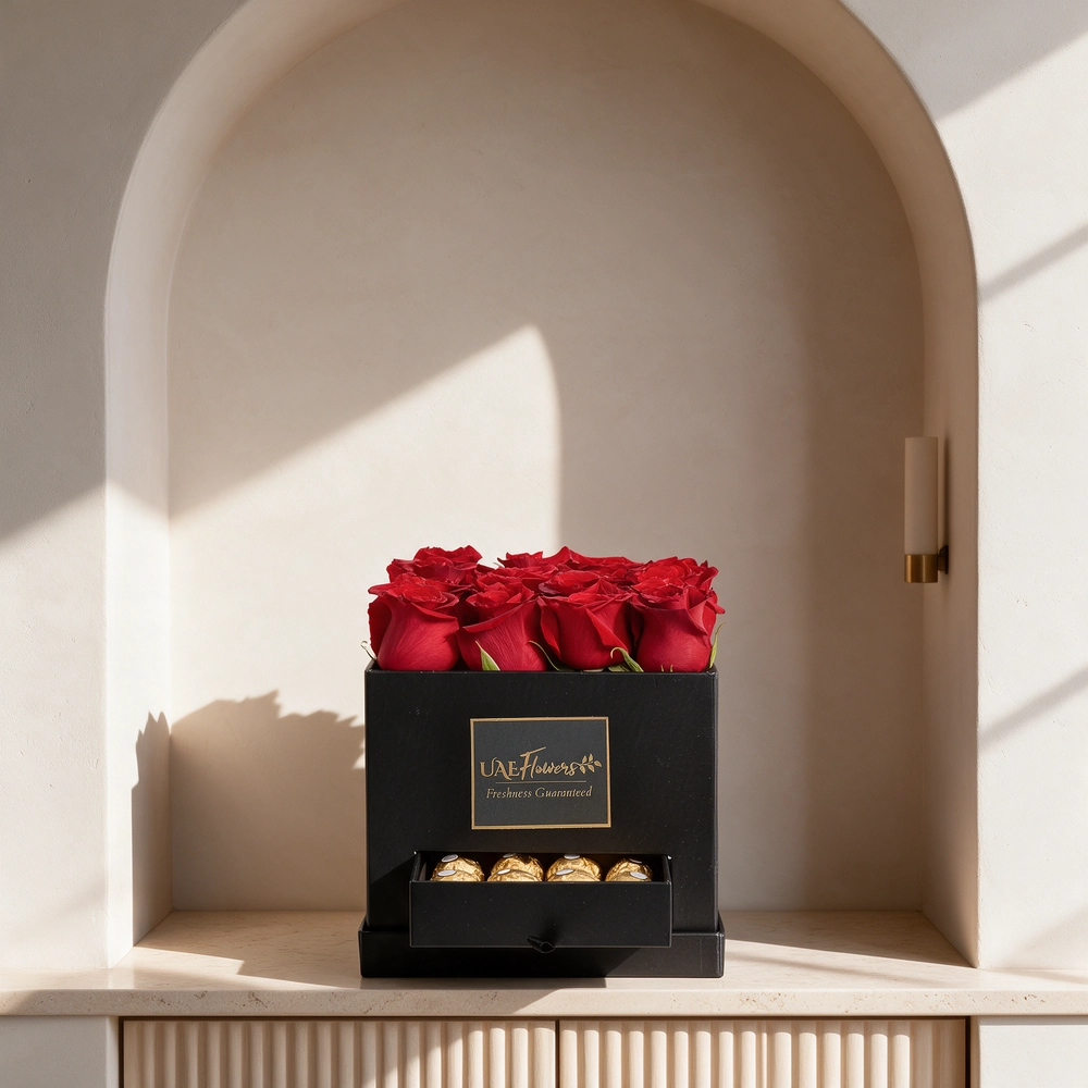 Black gift box with 16 red roses and 16 Ferrero Rocher chocolates, perfect for romantic occasions, anniversaries, or expressing love.
