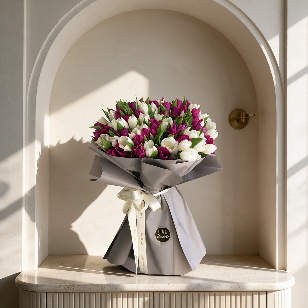 bouquet of 40 white and 40 purple tulips arranged in grey paper wrap