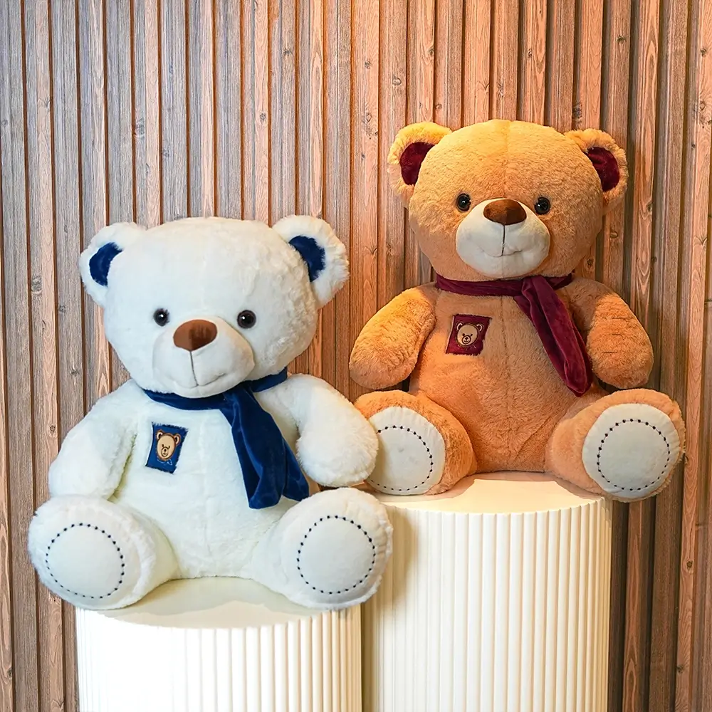 1 white & 1 brown medium sized teddy bears