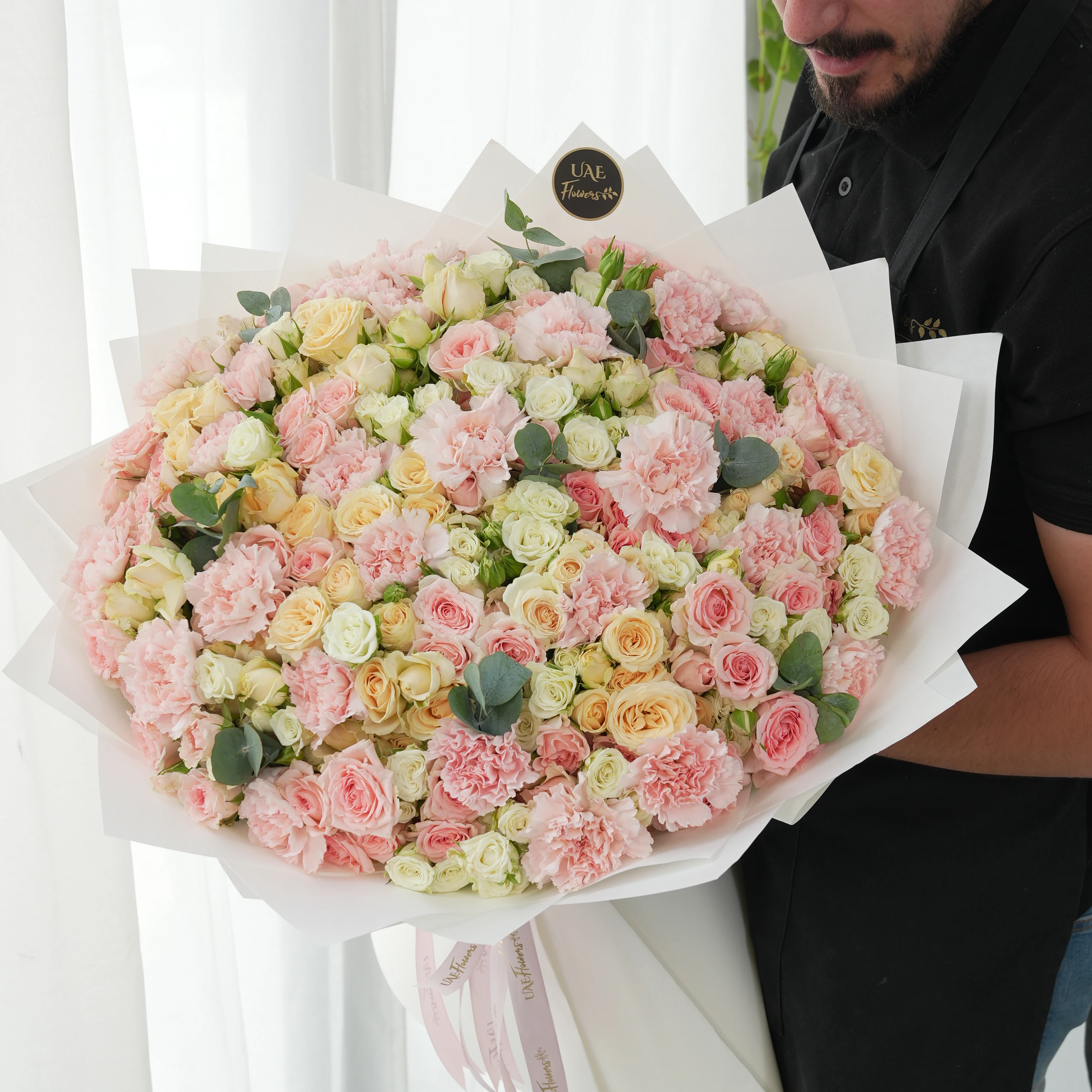 bouquet with 40 mixed spray roses and 20 pink carnations