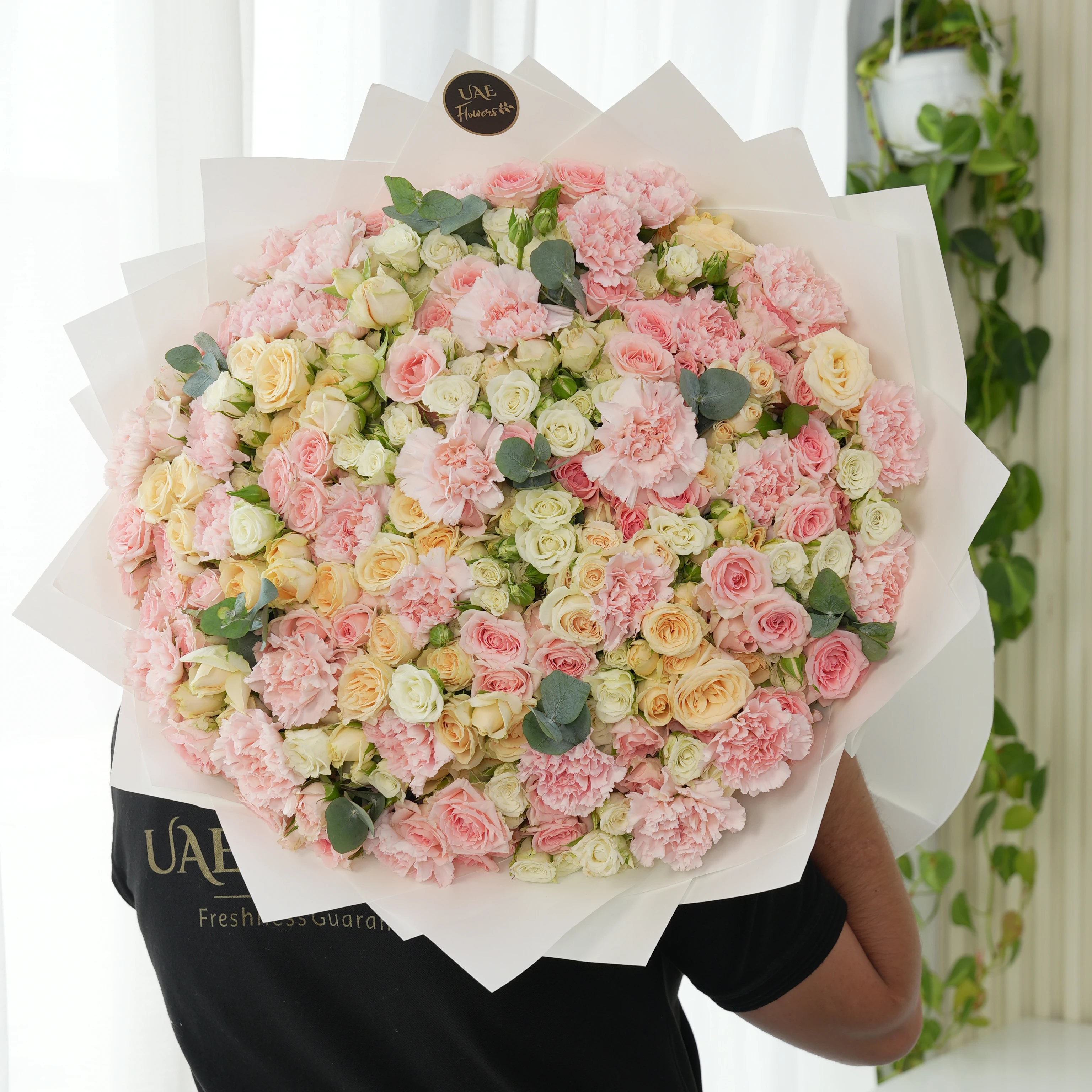 bouquet with 40 mixed spray roses and 20 pink carnations