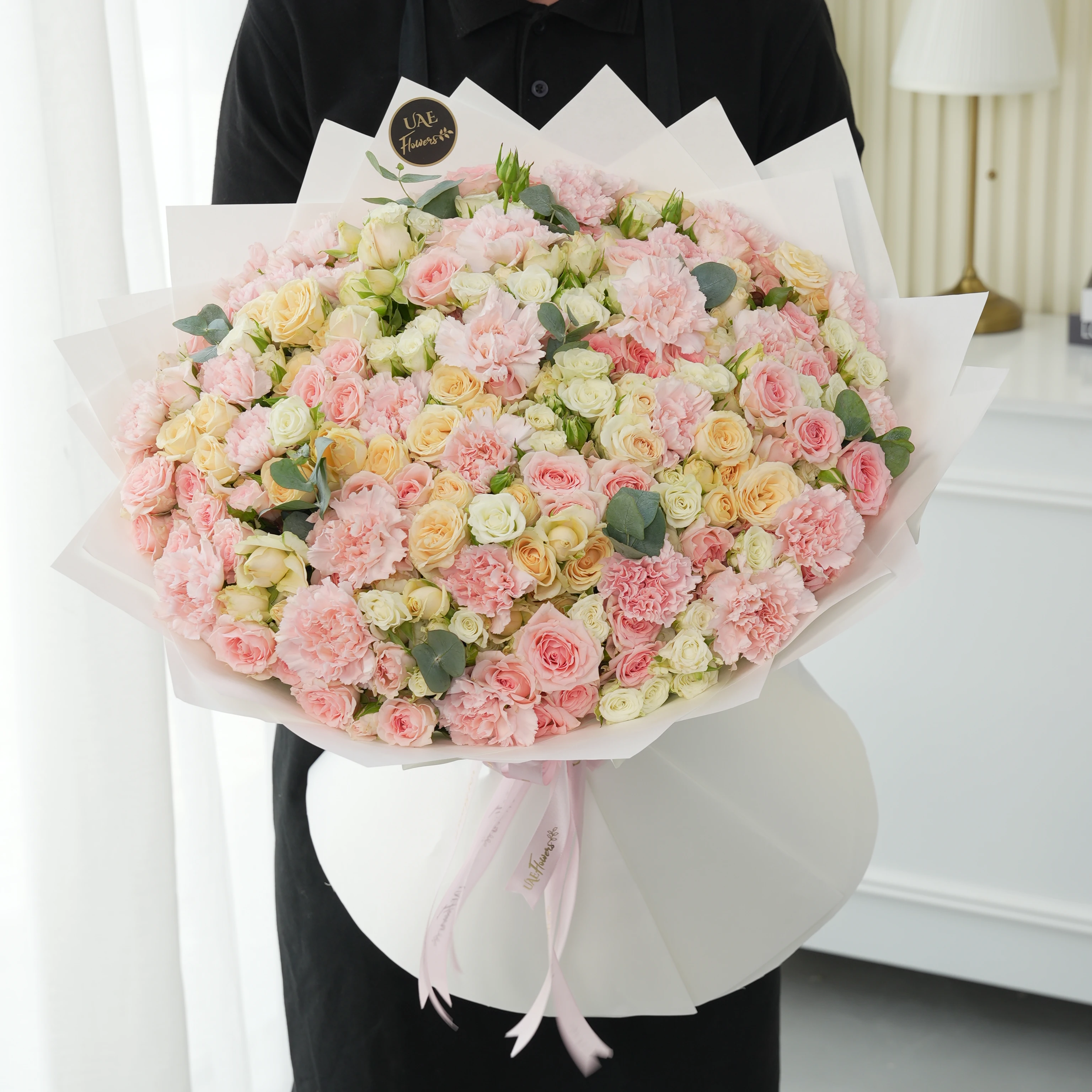 bouquet with 40 mixed spray roses and 20 pink carnations
