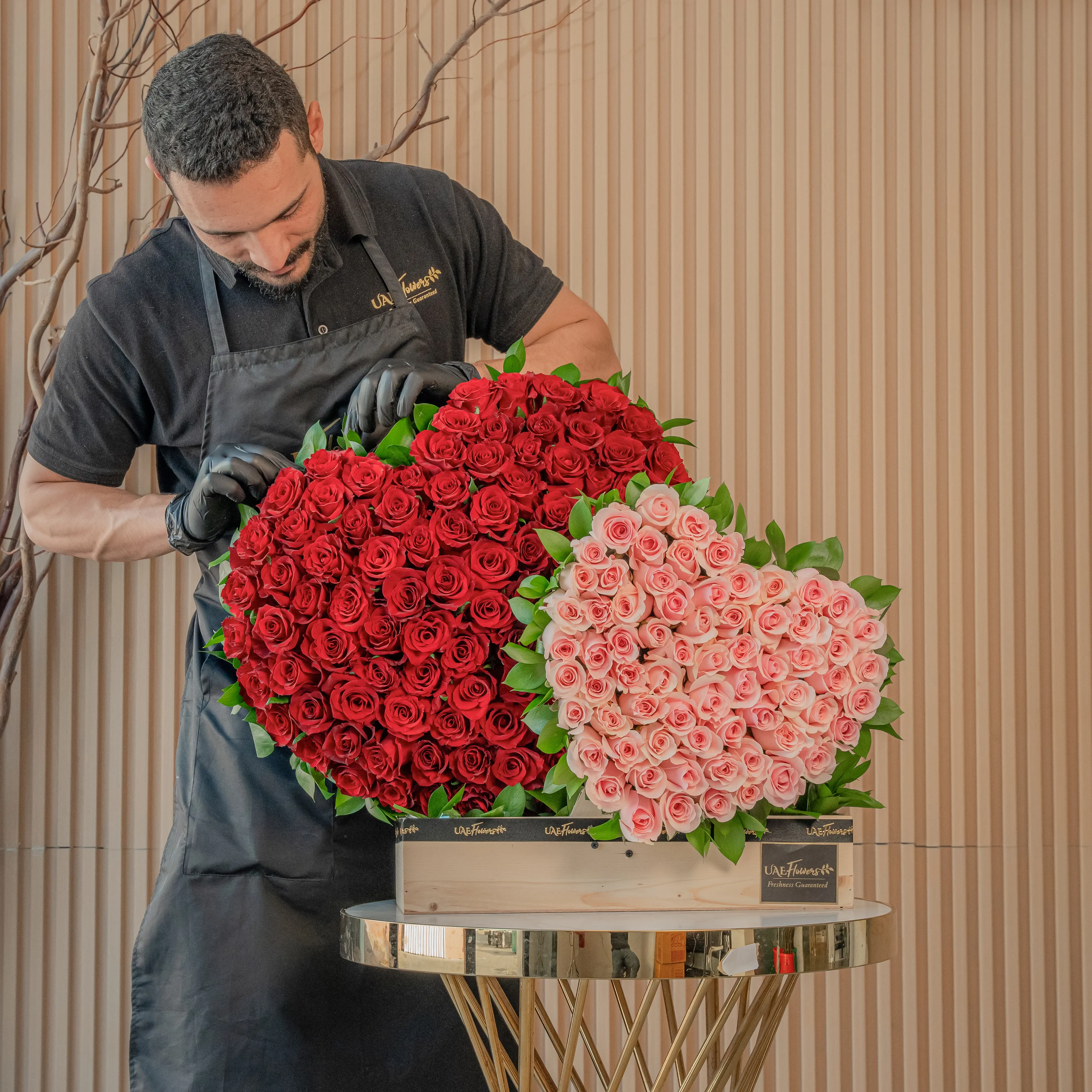 duo heart arrangement has 100 red roses and 50 pink roses